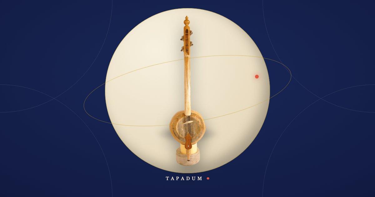 A kabak kemane, the Turkish pumpkin-bodied folk fiddle, standing upright in a glowing circle