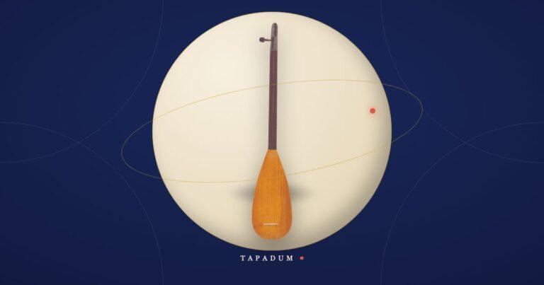 Turkish kopuz, the ancient long-necked lute and ancestor of the baglama family, resting in a glowing circle