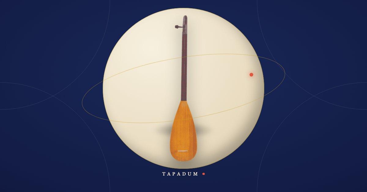 Turkish kopuz, the ancient long-necked lute and ancestor of the baglama family, resting in a glowing circle