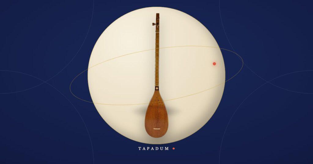 A Persian tanboor, the pear-shaped long-necked lute of the Ahl-e Haqq (Yarsan) tradition, resting in a glowing circle