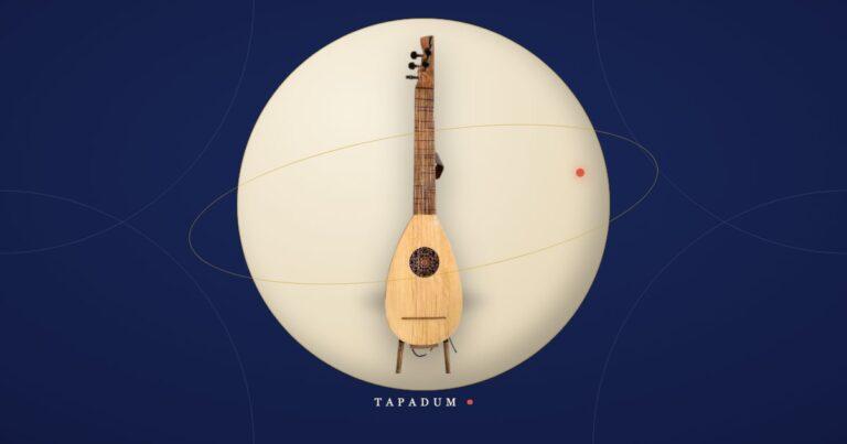 An oğur sazı, Erkan Oğur's modern six-string baglama reinvention, standing in a glowing circle